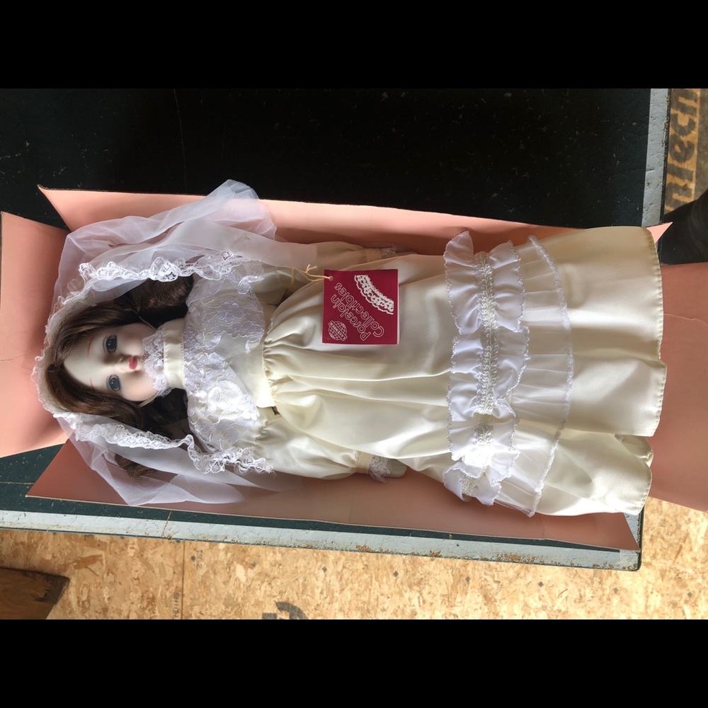 Collectable porcelain doll with wedding dress